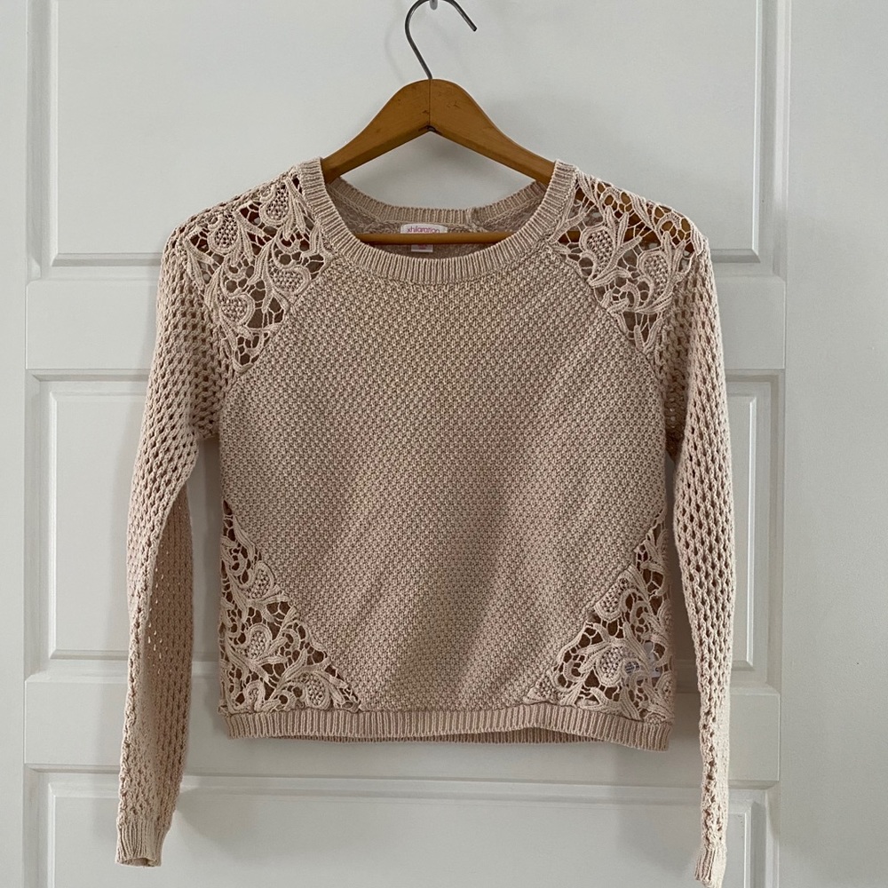 Beige and orange sweaters